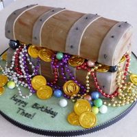 Treasure Chest Cake covered with fondant. 'Lid' is rice krispie cake. Made for my son for his birthday.