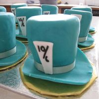 Mad Hatter Hat Cake Cakes carved into hat shape, covered in fondant with fondance accents. Made for a friends daughter who was having an Alice in Wonderland...