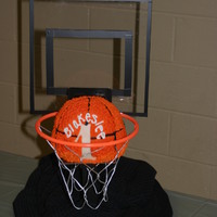 Basketball Groom's Cake Chocolate cake with raspberry filling, orange buttercream frosting.