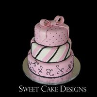 Pink Bow Fondant covered cake (12, 10, and 8 inch) with gumpaste bow dusted with pearl dust. Royal icing scrolls and beading. Thank you to...
