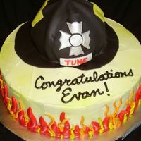 They Call Me The Fireman... Cake for fire school graduate. Dark Chocolate fudge with buttercream filling. Buttercream icing and gumpaste/fondant helmet. TFL!