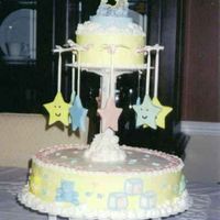 Kim's Baby Shower Double layer round 14in cake on bottom. Iced in Buttercream. Buttercream clouds, Fondant baby accents, Fondant Stars. "Hey diddle...