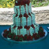 Strawberry Tower This wedding cake was done in Phoenix, AZ in early June. By the time I got the cake to the reception it had started leaning. Maybe it was...