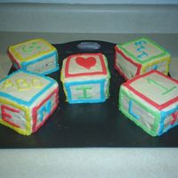 Daughter's 1St B-Day This was for my daughter's 1st birthday. I learned so much doing this cake. 1. Place one block on the board at a time. 2.Take your...