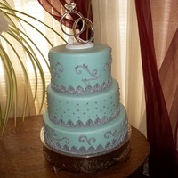 Blue Scrolls cake is covered in fondant and has gum paste scrolls and silver dragees