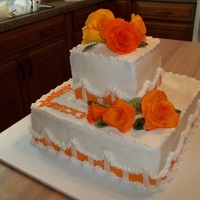 Orange Roses butter cream frosting with gum paste roses