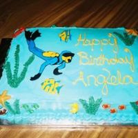 Scuba_Diver.jpg The scuba diver is made with color flow. This was actually a banana cake with banana creme filling. I thought it would be odd with blue...