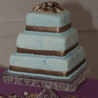 Blue/brown Square Cake This was cake was for a beach themed party. Covered in MMF with chocolate mold seashells on top