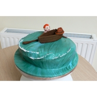 Shipwrecked But Happy!! My husband wanted a cake for his friend who loves sailing. The photo doesn't show clearly the body behind getting back into the boat...