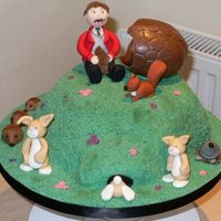 Spring Fair / Easter Cake This cake was made for a raffle prize at my sons Spring / Easter Fair. It is all fondant / gumpaste apart from the large egg which was one...