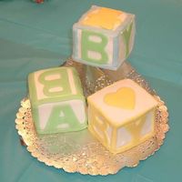Baby Blocks Fondant covered and fondant cut-out letters and strips for trims. Each block is a 3 3 /4" cube. Cubes were created using chocolate...
