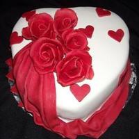 Valentines I made this cake for my husband on Valentines is fondant and the flowers and drape are made with chocolate clay