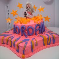 Hannah Montana I made this for my best friends little girl. I love how it turned out. I added a blue feather boa around the cake board after taking the...