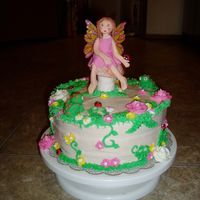Fairy In A Forest Cream cheese frosting w/buttercream and fondant decorations. For my 6 year old's birthday