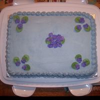 Purple Violets Chocolate cake with buttercream frosting. Royal icing violets.