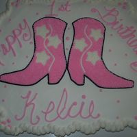 Cowgirl Birthday Party Cupcake Cake For some friends little girl that was turning one. I didn't like the way the boots turned out, wish I could of found something that...