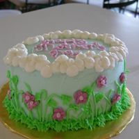 Spring Flowers! Yellow cake with mocha chocolate mousse filling and BC. I made this cake for mother's day. I have clouds as a border and royal icing...