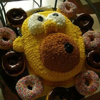 Homer Simpson Cake My brother asked me to make him a Homer cake for his birthday. I added donuts cuz Homer feels incomplete without them :) Inspired by MorPia...