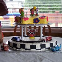 2Nd Birthday For My Boy/girl Twins I had to invent a cake for my twins this year. I combined Cars with Dora. Turned out fairly well I think.