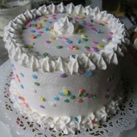 Star City Whipped cream white cake with bananas and whipped cream in center. LOL, i remember...I almost ran out of whipped cream icing, so i opted...