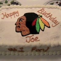 Chicago_Blackhawks.jpg My husband's uncle is a HUGE Chicago Blackhawks fan and wanted a cake with their logo on it.