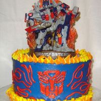 Optimus Prime Made this for my son's birthday in November. All buttercream, bought the topper for him to keep.