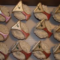 Martini Cupcakes Chocolate cupcakes w/white BC. Martini glass is made out of color flow and decorated w/edible markers and luster dust.