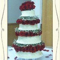 Diamonds & Pearls 4 tier cake with fresh roses and baby's breathe. Decorated with diamond impressions and edible pearls.