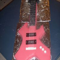 Warlock Guitar Cake This is my 1st carved and fondant covered cake. It's got a few booboos but I'm pretty proud of it. It wasn't done entirely...