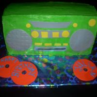 Boombox Cake Caramel cake with a chocolate ganache filling. Covered with BC icing and fondant embelishments.