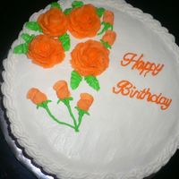 Birthday Cake White cake with lemon curd filling. Covered in BC frosting and orange roses and rose buds. Very first cake I sold!!