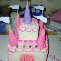 Castle_Cake_1.jpg princess castle cake. I made it for my niece for her 1st birthday it has yellow jaw breakers for around the door. the thing that the flags...