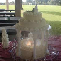 My First Wedding Cake it was my first wedding cake my mother in law helped me we made the flowers also the sides of the cake looked like it had lace on it took...