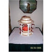 Reunioncake.jpg This was my class reunion cake i made but it could be used as a wedding cake as well the flowers around the pillirs are fake flowers just...