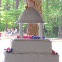 Sweet 16 Yellow cake covered in bc and fondant, with fondant roses and bc accents.