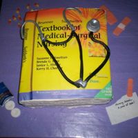 Nurse Book This cake was inspired by a cake littlegrahmcracker did. My mother went back to school at the age of 53 and will graduating as an RN in May...