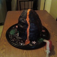 Lava Shooting Volcano Cake The cake is made of marble cake covered in fondant. A hand pumo was inserted in the center of the cake and when pressed it shoots lava out...