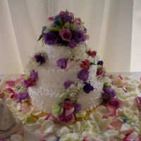 Floral Garden Wedding Cake This is one of my favorite cakes I have done. The design has random vines and fresh mixed flowers. The table of rose petals made the...