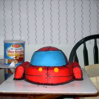 Little Einsteins Rocket Rocket from the Little Einsteins. The dome is made out of chocolate and the base is WASC with bavarian cream filling. The engines on either...