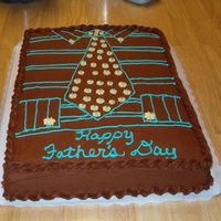 Fatherly Attire This is a chocolate cake decorated as a shirt and tie depicting what Father wears daily to work!