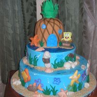Spongebob 14" inch, 10" inch, and the pineapple is 6 inch. Pineapple covered in fondant, all othersbuttercream. All decorations are...