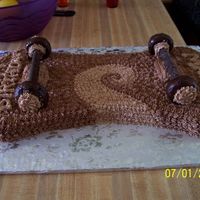 Chocolate Skateboard the wheels are doughnuts and the trucks are cookie sticks.