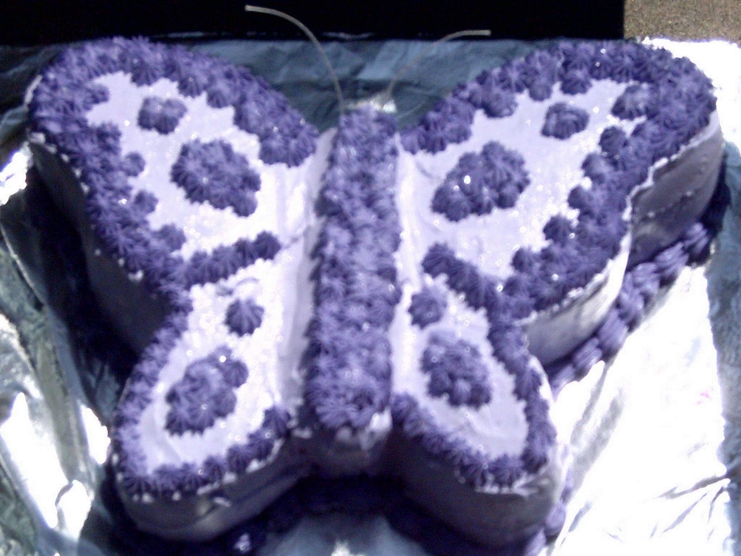 Better Pic Of Purple Butterfly First carved cake, made for my future (maybe!) daughter-in-law. White almond cake with Whim. Bakehouse buttercream.