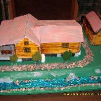 Cabin Side 1 This cake was for a 70 year old. It is the cabin he built and his daughter wanted it in cake form. The 2 cabins and the barn are cake....