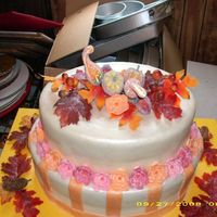 Fall Wedding Theme Chocolate cake with starburst flowers.