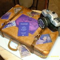 Vintage Suitcase With Camera This is a vintage style suitcase with travel stickers and camera and passport.White cake covered with fondant. Buckle and camera lens and...