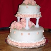 Tier Wedding Cake My cake is a chocolate cake with white buttercream icing, white fondant with peach royal icing petunias and Juniper green leaves, with...