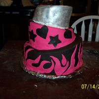 My First Topsy Turvy Cake Sweet 16 Cake topsy turvy cake. top layer is silver luster dust. cake is covered in chocolate fondant