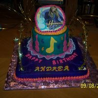 Hannah Montana covered in fondant. edible image on top. top layer is gold luster dust. cake was airbrushed