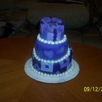 Topsy Turvy Cake my 2nd topsy turvy cake. all fondant airbrushed purple. pearls are fondant air brushed with pearl dust.